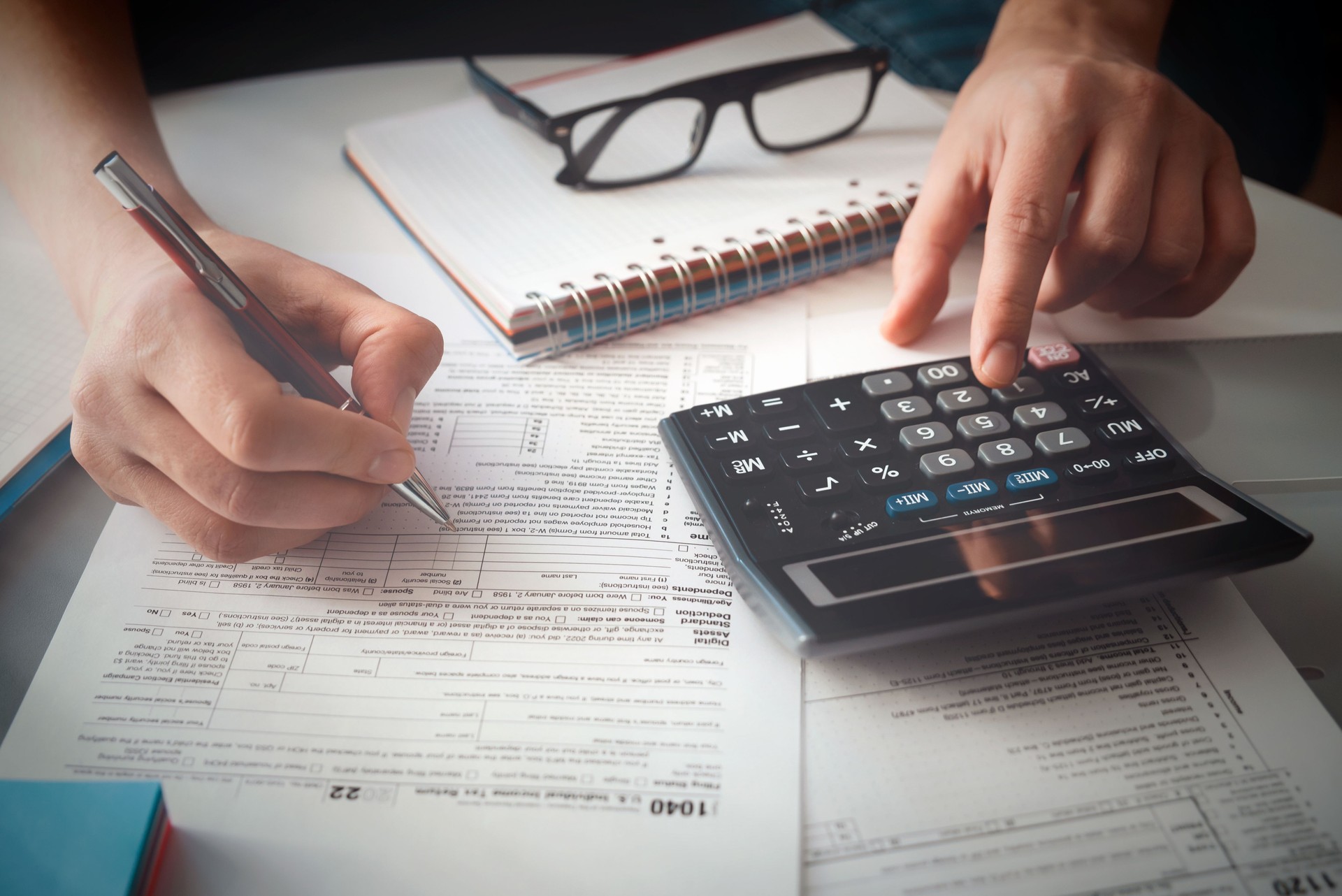 Tax time, tax concept with man filling tax form